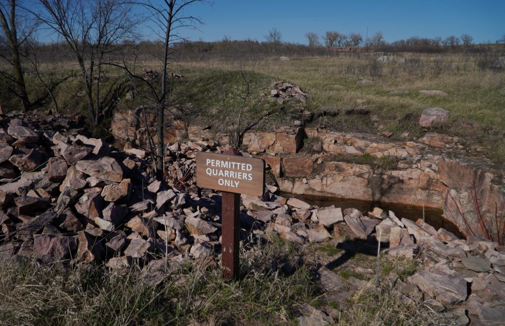 Piles of broken quartzite surround the quarries where the sacred pipestone, used to carve pipes for indigenous ritual and ceremonies, is chiseled and broken free by those enrolled in a federally recognized tribe, on Tuesday, May 2, 2023, in Pipestone, Minn. 