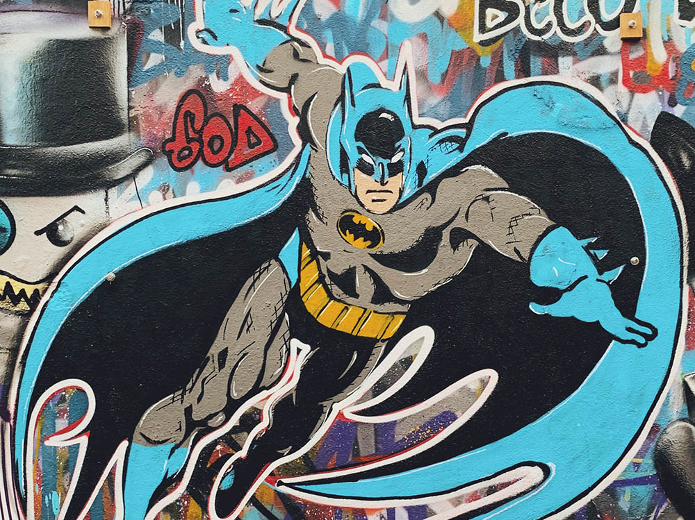 The comic book character Batman is seen depicted in street graffiti. (Pixabay/Luiz Gomes)