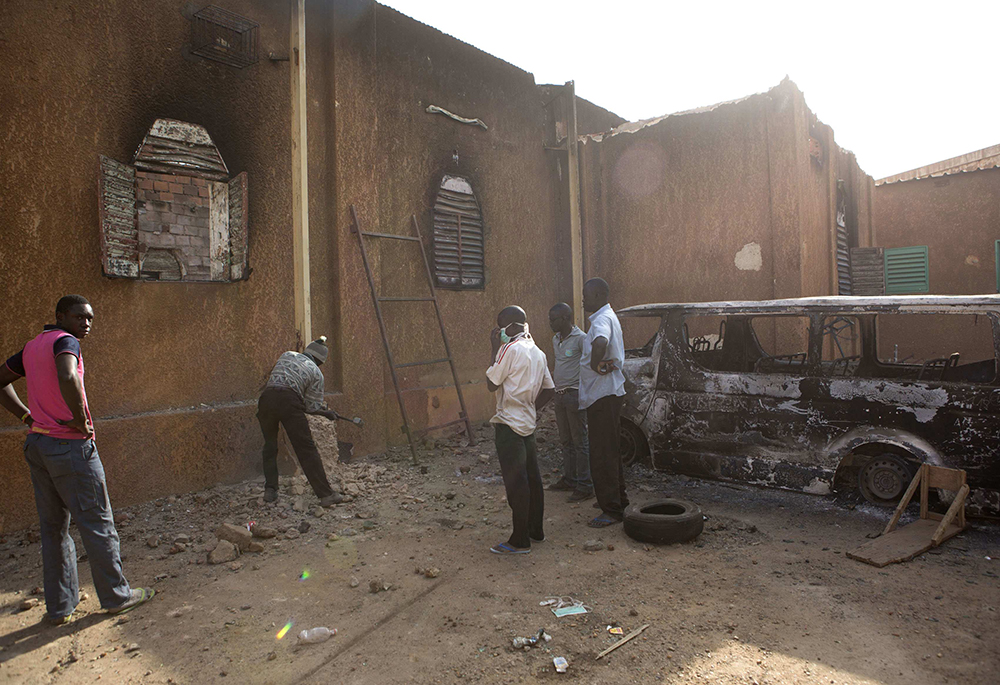 Men start reconstruction on a church Jan. 23, 2015, in Niamey, Niger, that was destroyed in violent protests against French satirical magazine Charlie Hebdo's cartoons of the prophet Muhammad. (CNS/Reuters/Joe Penney)