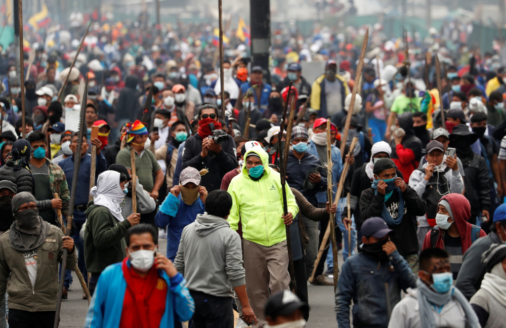 Demonstrators hold spears as they take part in a protest against then-Ecuadorian President Lenin Moreno's austerity measures in Quito, Ecuador, Oct.1, 2019.  (CNS photo/Carlos Garcia Rawlins, Reuters) 