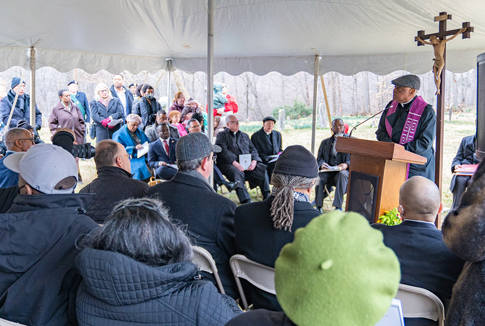 Washington Cardinal Wilton Gregory leads a prayer service Feb. 25 for enslaved people believed to be buried in unmarked graves at the cemetery at Sacred Heart Parish in Bowie, Maryland. The property is on a former plantation once owned by members of the Society of Jesus in the 1700s and 1800s. (OSV News/Catholic Standard/Mihoko Owada)