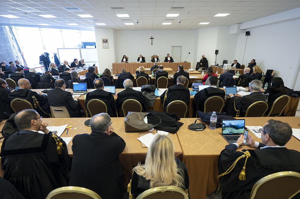 Lucia Bozzi, Venerando Marano, Giuseppe Pignatone and Carlo Bonzano, judges of the Vatican City State court, listen to proceedings March 16, 2023, during the trial of Cardinal Angelo Becciu and nine other defendants on charges of financial malfeasance. (CNS/Vatican Media)