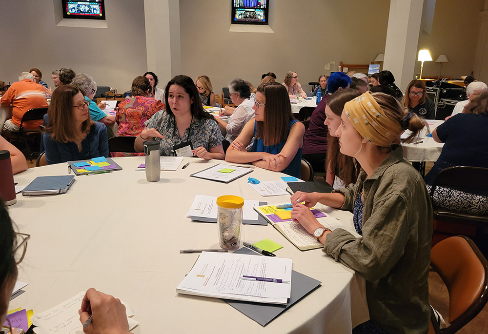 Participants at the Women of the Church conference share at small table discussions during the July 19-21 event at St. John's University in Collegeville, Minnesota. (NCR photo/Heidi Schlumpf)