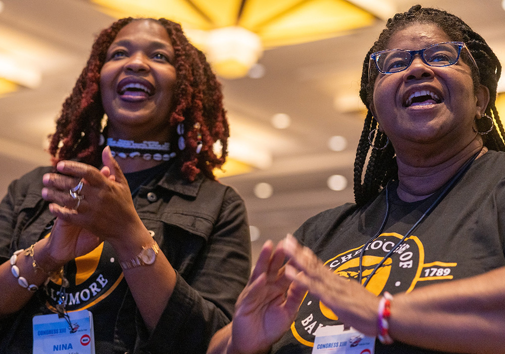 Nina Shipman-Vick and Valerie Grays from the Archdiocese of Baltimore participate in the opening plenary session of the 13th National Black Catholic Congress July 21 at the Gaylord National Resort & Convention Center in National Harbor, Maryland. (OSV News/Catholic Standard/Mihoko Owada)