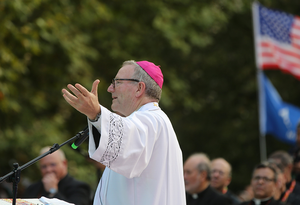 Bishop Robert Barron of Winona-Rochester, Minnesota, founder of Word on Fire Catholic Ministries, speaks at a National Gathering for U.S. pilgrims, at Quintas das Conchas e dos Lilases Park Aug. 2 in Lisbon, Portugal, during World Youth Day. (OSV News/Bob Roller)