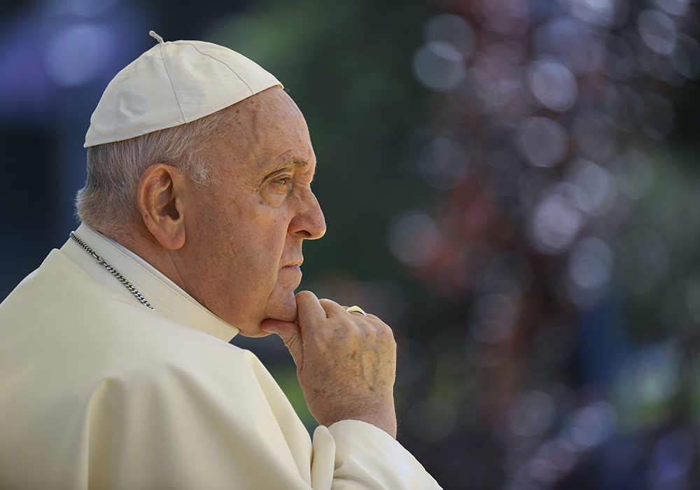 Pope Francis listens to a young person during a meeting with university students at the Catholic University of Portugal Aug. 3 in Lisbon. On Aug. 2 Francis capped off his first day in Portugal by meeting with 13 clergy abuse survivors. (CNS/Vatican Media)