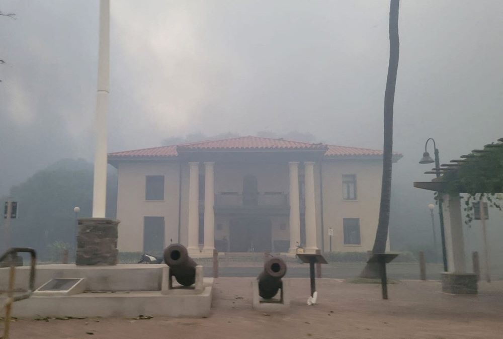 Smoke obscures an old courthouse Aug. 9, 2023, as wildfires driven by high winds destroy a large part of the historic town of Lahaina, Hawaii, on the island of Maui. (OSV News/Reuters/Dustin Johnson)