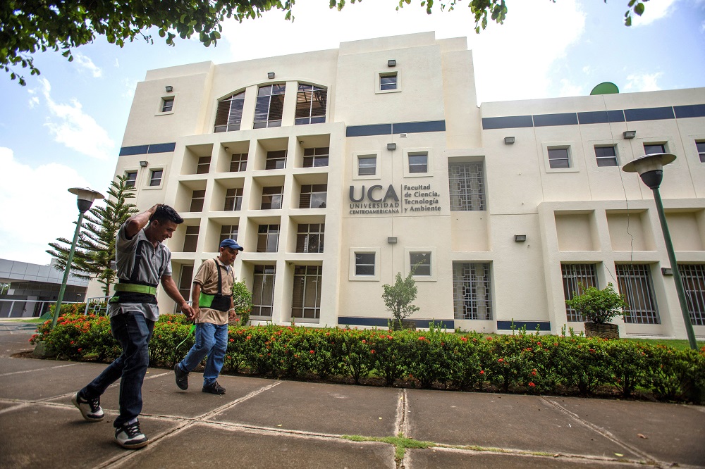 Workers walk past a building of the Jesuit-run Central American University in Managua, Nicaragua, Aug. 16, 2023. The university suspended operations Aug. 16 after Nicaraguan authorities branded the school a "center of terrorism" the previous day and froze its assets for confiscation.