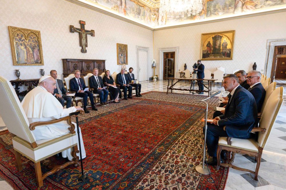 Pope Francis speaks to a delegation of European lawyers in the library of the Apostolic Palace at the Vatican Aug. 21, 2023.