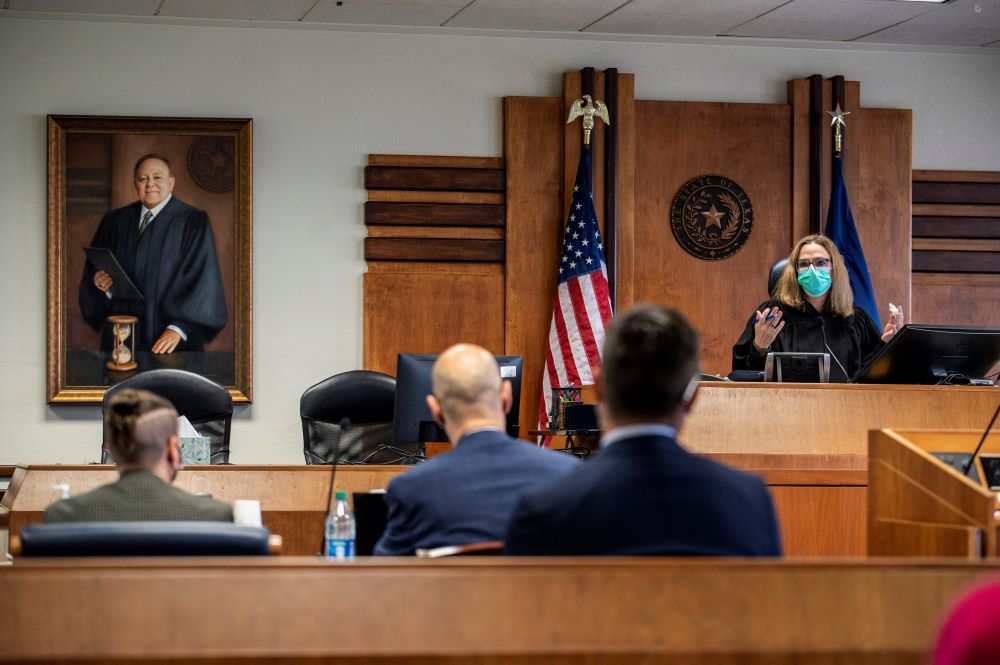 Judge Amy Clark Meachum addresses the court during a March 11, 2022, hearing in Austin, Texas, on Gov. Greg Abbott's order that parents of transgender children be investigated for child abuse.