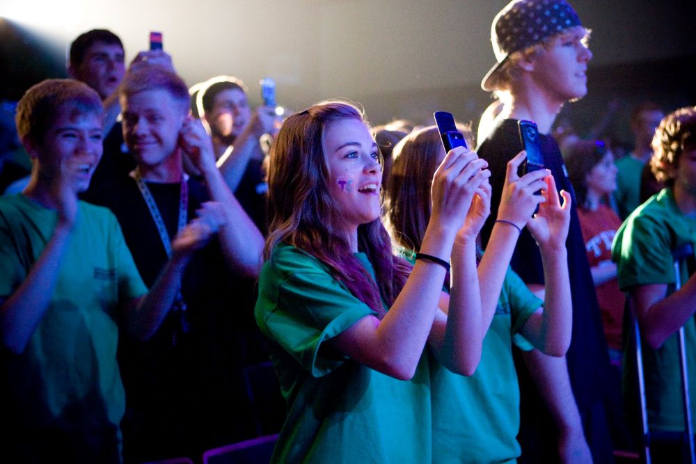 Students cheer and take photos with cellphones as singer Taylor Swift performs at Bishop Ireton High School in Alexandria, Va., April 28, 2009. (CNS/Jonathan Tramontana) 