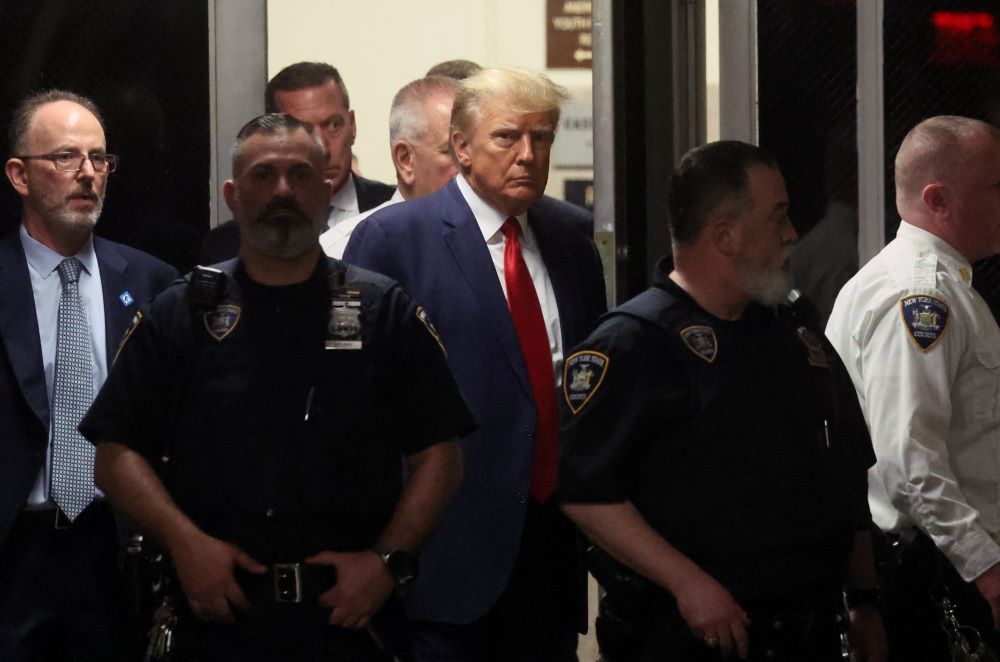 Former U.S. President Donald Trump arrives at the Manhattan Criminal Courthouse in New York City April 4, 2023, after his indictment by a Manhattan grand jury following a probe into hush money accusations. He was arraigned Aug. 3 on four felony charges related to his efforts to overturn the 2020 election. (OSV News/Reuters/Brendan McDermid)