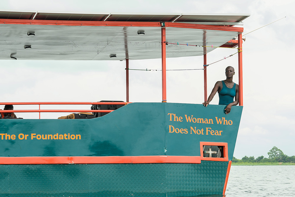 Ghanaian-British swimmer Yvette Tetteh poses on the research vessel "The Woman Who Does Not Fear," an aluminum, solar-powered catamaran equipped with a science laboratory. (Courtesy of the Or Foundation)