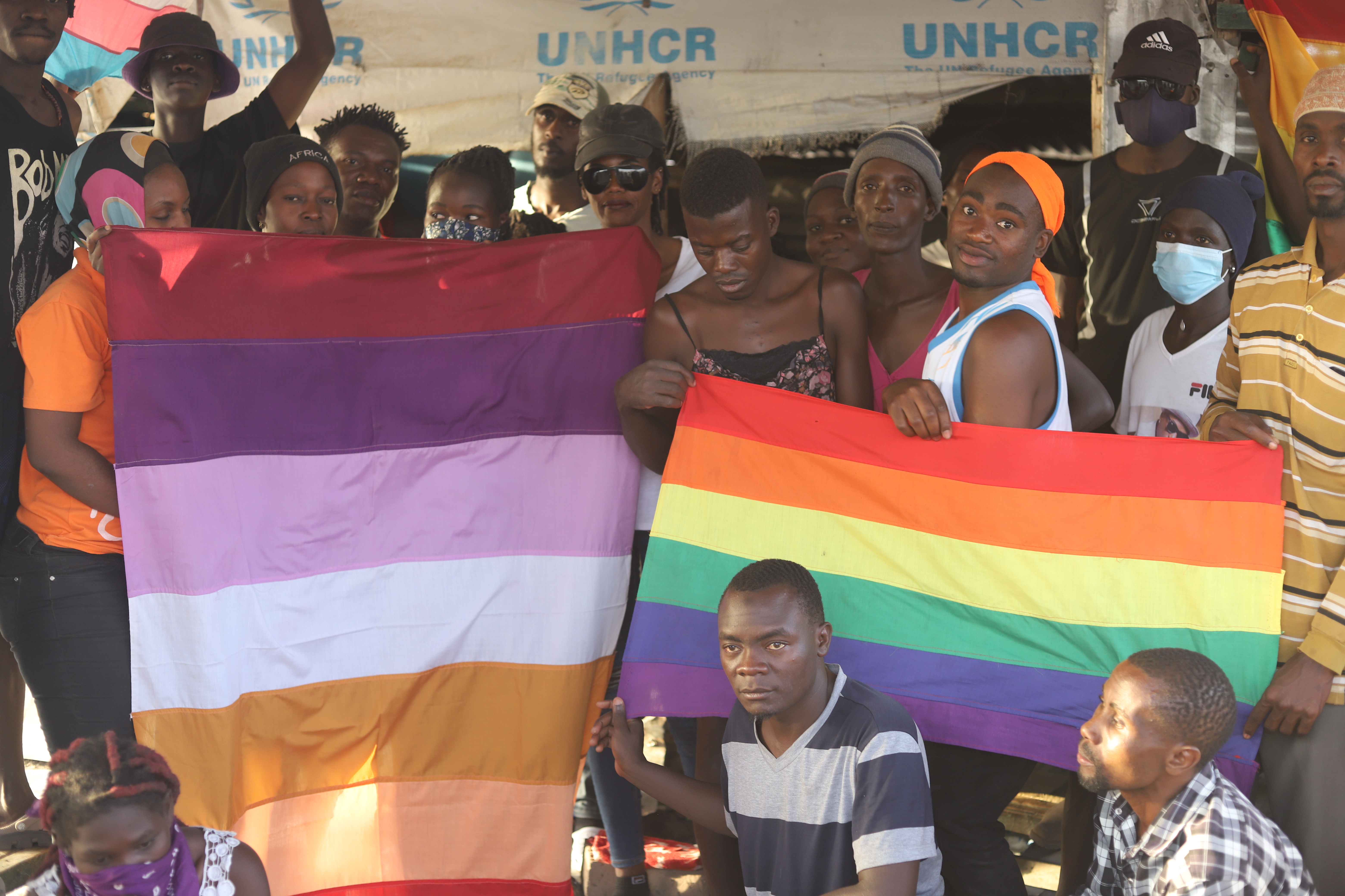 LGBTQ refugees in Kakuma Refugee Camp, located in Kenya's northwestern region, hold their rainbow flags as they pose for a photo on Feb. 18. (NCR photo/Doreen Ajiambo)