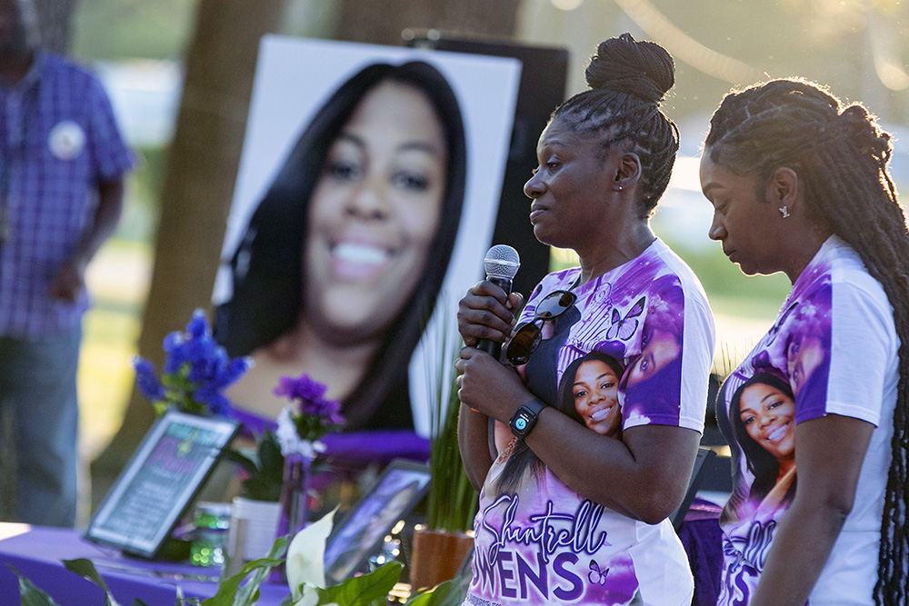 Pamela Dias, second from right, remembers her daughter, Ajike Owens, as mourners gather for a remembrance service for Owens at Immerse Church of Ocala, Florida, on June 8. Susan Lorincz, who is accused of firing through her door and fatally shooting Owens, was charged on June 26 with manslaughter and assault. (AP/Alan Youngblood, File)