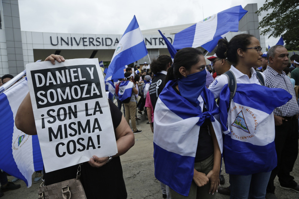 Demonstrators protest outside the Jesuit-run Universidad Centroamericana, UCA, demanding the university's allocation of its share of 6% of the national budget in Managua, Nicaragua, on Aug. 2, 2018. The Jesuits announced Wednesday, Aug. 16, 2023, that Nicaragua's government has confiscated the UCA, one of the region's most highly regarded colleges. (AP Photo/Arnulfo Franco, File)
