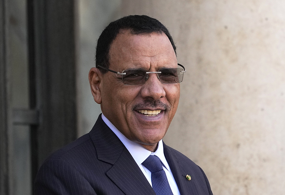 Niger's President Mohamed Bazoum smiles before a working lunch with French President Emmanuel Macron, Feb. 16 at the Elysee Palace in Paris. (AP photo/Michel Euler, file)