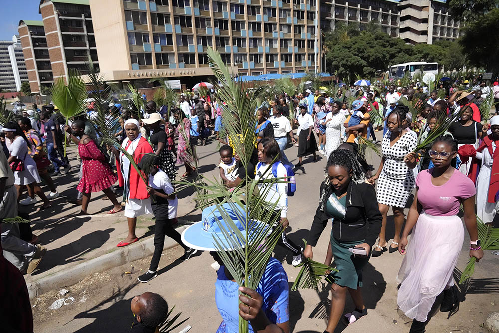 Faithful commemorate Palm Sunday outside a Roman Catholic church in Harare, Zimbabwe, April 2. (AP/Tsvangirayi Mukwazhi)