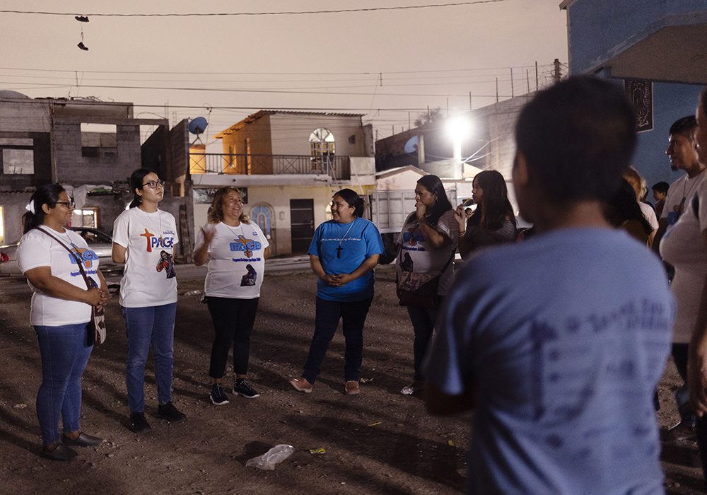 Missionaries Felicitas Martínez Hernández, from left, Josseline Carolina Montes Jiménez, Raquel Torres Gatica, Sr. Sandra López García and Yolanda Martínez Hernández go around the circle saying what they are grateful as they conclude one of their visits to youth gangs on the streets of Monterrey, Mexico, in May. (Nuri Vallbona)