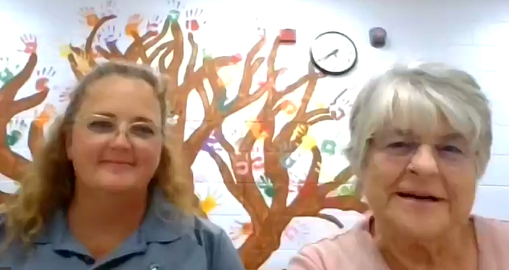 Holly Cerveny, left, and Ellen Heitman, right, accept the Laudato Si' Champion award for parishes on behalf of St. Catherine of Alexandria/St. Joan of Arc Cluster Parish in Nashotah, Wisconsin, during the "Laudato Si' and the U.S. Catholic Church" conference on July 27. (NCR screenshot)