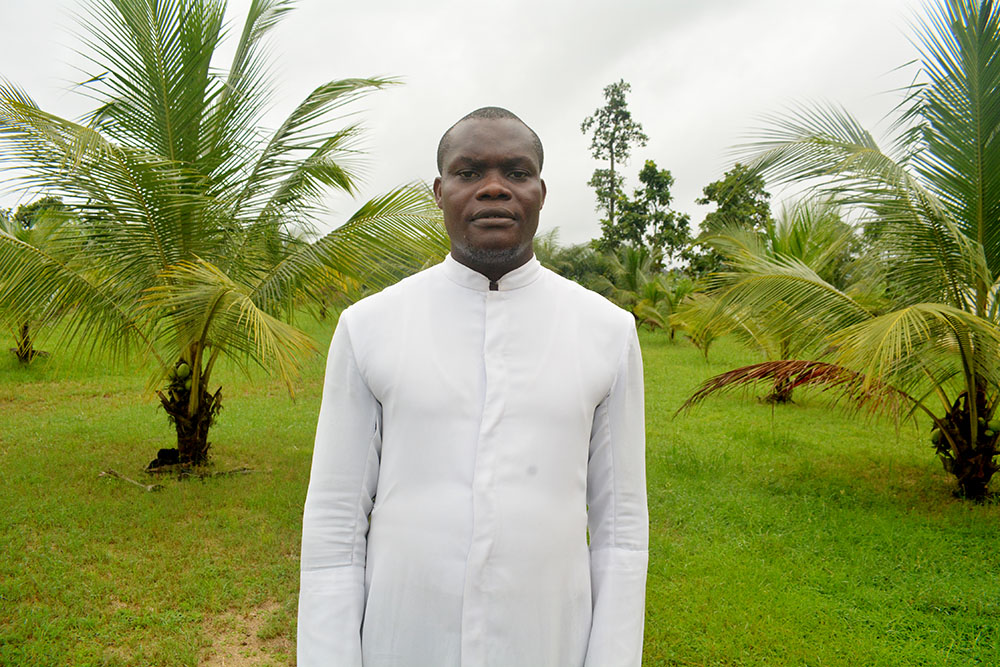 Fr. Zachariah Fufeyin, director of the Justice Development and Peace Commission in the Bomadi Diocese poses for a photo in the bishop’s court in Bomadi, in Nigeria’s oil-rich Bayelsa State. (EarthBeat photo/Valentine Benjamin)