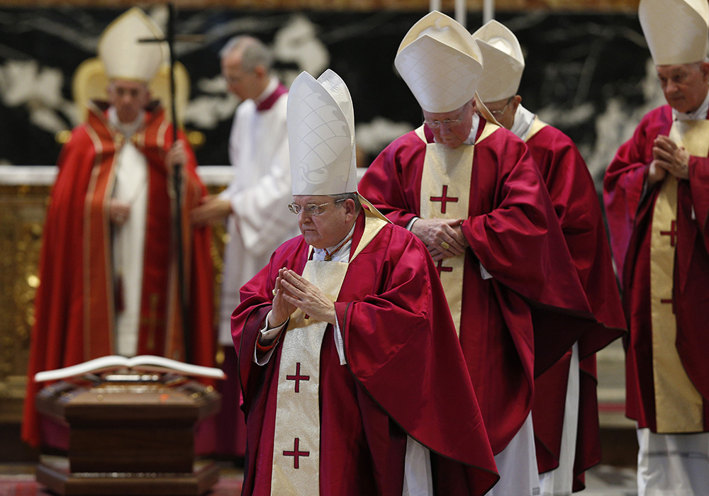 Pope Francis is pictured as U.S. Cardinal Raymond Burke, U.S. Cardinal J. Francis Stafford, German Cardinal Walter Kasper and Canadian Cardinal Marc Ouellet leave the funeral Mass of U.S. Cardinal William Levada in St. Peter's Basilica Sept. 27, 2019, at the Vatican. (CNS/Paul Haring)