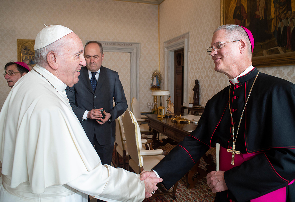 Pope Francis greets Archbishop Paul Etienne of the Archdiocese of Seattle, Washington, during a meeting with bishops from Washington, Oregon, Idaho, Montana and Alaska making their "ad limina" visits to the Vatican Feb. 3, 2020. (CNS/Vatican Media)