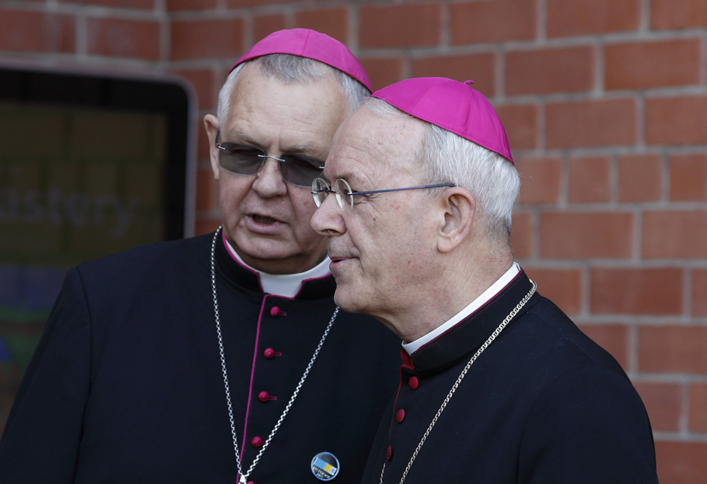 Archbishop Tomasz Peta of the Archdiocese of Maria Santissima in Astana, Kazakhstan, talks with Auxiliary Bishop Athanasius Schneider of the same archdiocese, before Pope Francis' meeting with bishops, priests, deacons, consecrated persons, seminarians and pastoral workers at the cathedral of Our Lady of Perpetual Help in Nur-Sultan, Kazakhstan, Sept. 15, 2022. (CNS/Paul Haring)