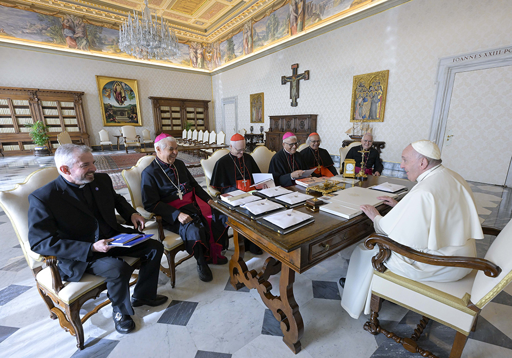 Pope Francis meets with leaders of the Latin American bishops' council, or CELAM, in the library of the Apostolic Palace at the Vatican Oct. 31, 2022. From the left: Fr. Pedro Manuel Brassesco; Archbishop Rogelio Cabrera López of Monterrey, Mexico; Cardinal Odilo Pedro Scherer of São Paulo; Archbishop Héctor Cabrejos Vidarte of Trujillo, Peru; Cardinal Leopoldo Brenes Solórzano of Managua, Nicaragua; and Archbishop Jorge Eduardo Lozano of San Juan de Cuyo, Argentina. (CNS/Vatican Media)