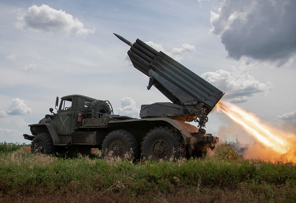 Ukrainian servicemen fire a BM-21 Grad multiple launch rocket system toward Russian troops near a front line in Ukraine's Donetsk region June 21, amid Russia's ongoing war on the country. (OSV News/Reuters/Oleksandr Ratushniak)