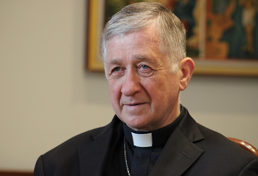 Chicago Cardinal Blase Cupich listens to a Ukrainian refugee family talk during a July 1, 2023, visit at the Basilian Sisters' monastery in Lviv, Ukraine. Cupich spoke Sept. 26 at Fordham University to commemorate Cardinal Joseph Bernardin's "consistent ethic of life" speech in 1983. (OSV News/Gina Christian)