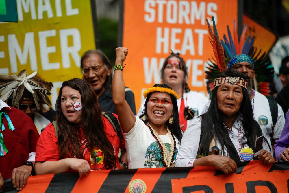 An Indigenous woman gestures as activists mark the start of Climate Week in New York City Sept. 17, 2023, during a demonstration calling for the U.S. government to take action toward ending fossil fuel use in order to reduce the impact of global climate change. (OSV News Photo/Eduardo Munoz, Reuters)