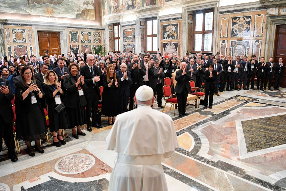Pope Francis arrives for a meeting with the rectors of public and private universities from Latin America and the Caribbean at the Vatican Sept. 21, 2023. Responding to questions, the pope said his new document on the environment would be called "Laudate Deum" (Praise God). (CNS/Vatican Media)