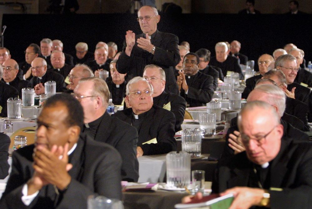 Bishops applaud at 2002 USCCB meeting