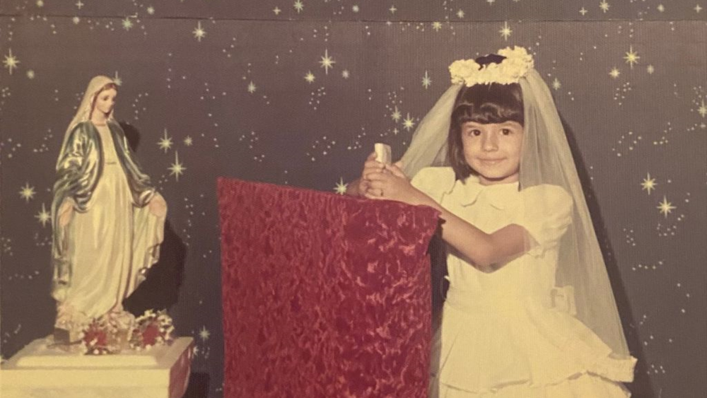 Deborah Rodriguez is pictured as a 6-year-old on her first Communion day, a few years before she was molested by a Catholic priest.