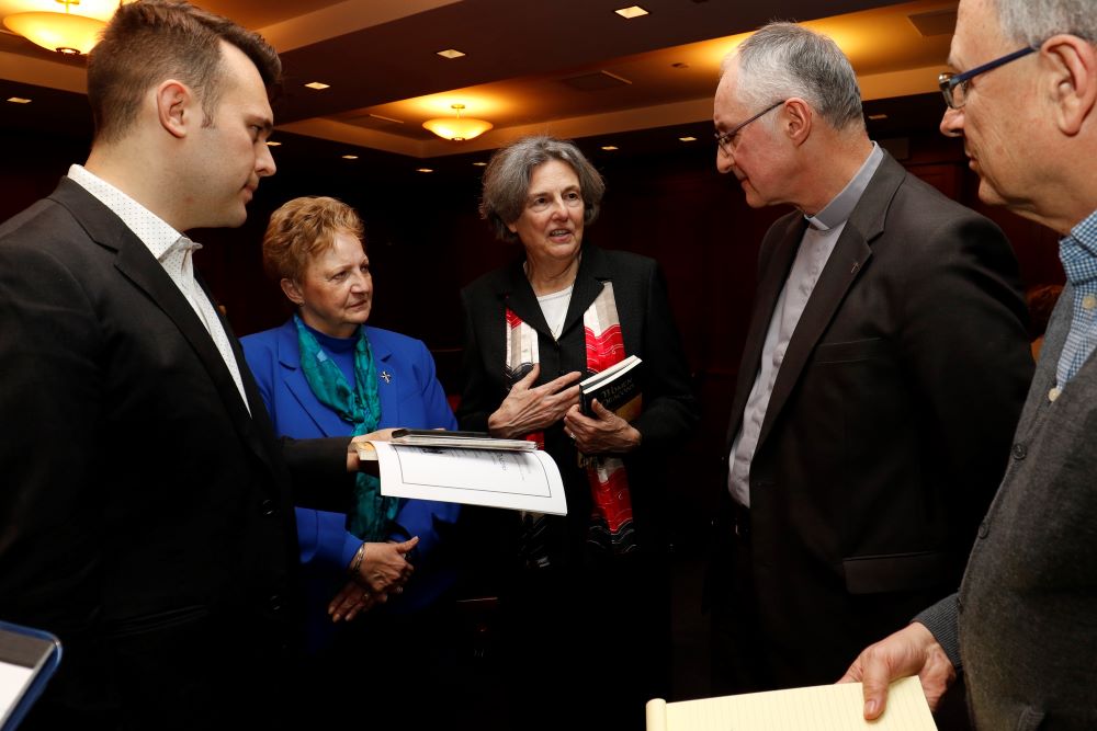 Catholic scholar and author Phyllis Zagano is flanked by Dominican Sister Donna Ciangio and Jesuit Fr Bernard Pottier as she speaks with journalists before a 2019 symposium on the history and future of women deacons in the Catholic Church. The event was  hosted by the Fordham Center on Religion and Culture. (CNS/Gregory A. Shemitz)