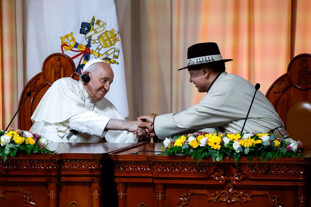 Pope Francis shakes hands with Mongolian President Ukhnaagiin Khürelsükh during a meeting with government and political leaders, diplomats and representatives of civil society in the Ikh Mongol Hall of the State Palace in Ulaanbaatar, Mongolia, Sept. 2. (CNS/Lola Gomez)