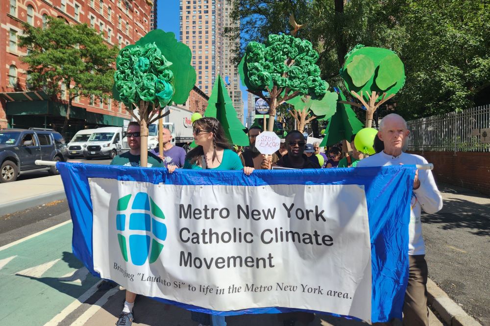 Participants with the banner of the Metro New York Catholic Climate Movement