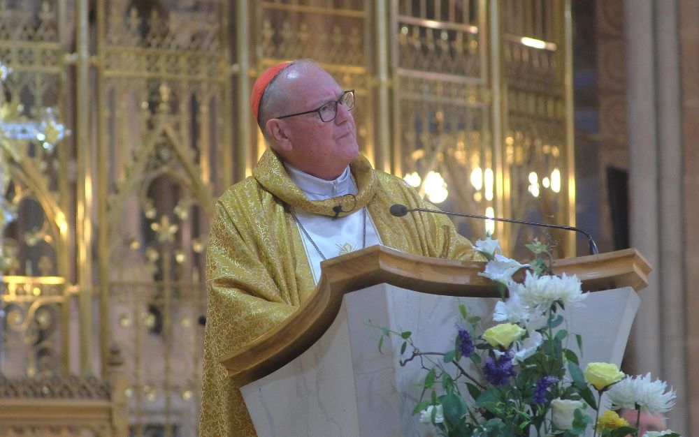 Cardinal Timothy Dolan speaking in a church 