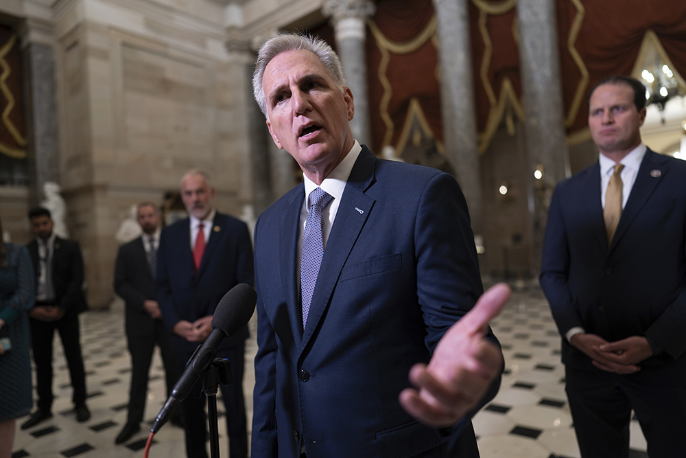 Speaker Kevin McCarthy, R-California, joined by other GOP members, talks to reporters just after voting to advance appropriations bills on the House floor, at the Capitol in Washington Sept. 26. (AP/J. Scott Applewhite)