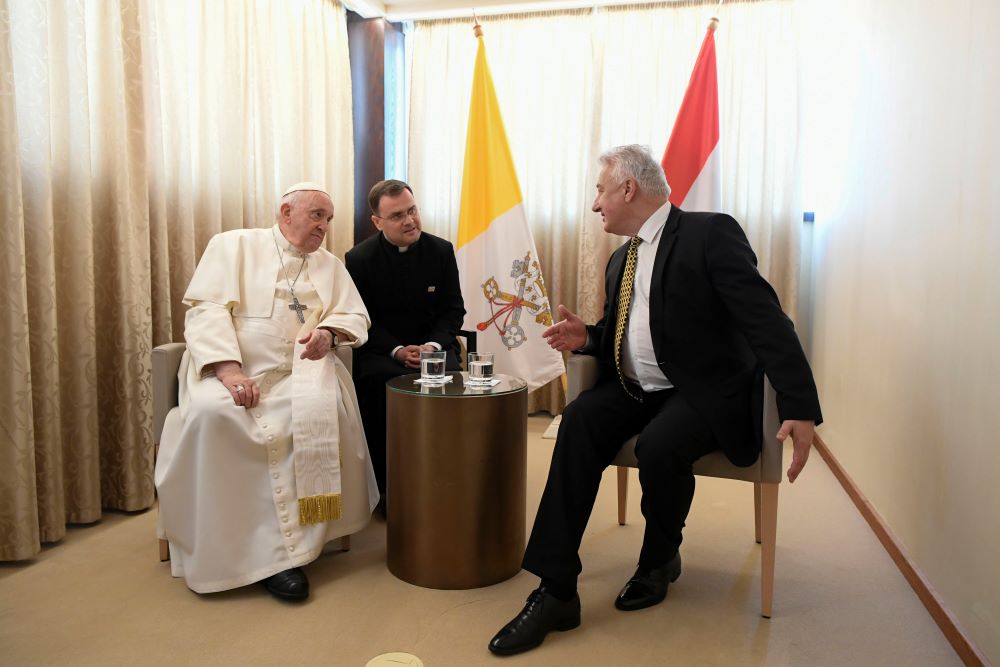 Pope Francis listens to Hungarian Prime Minister Viktor Orbán after his arrival at the international airport in Budapest, Hungary, April 28.