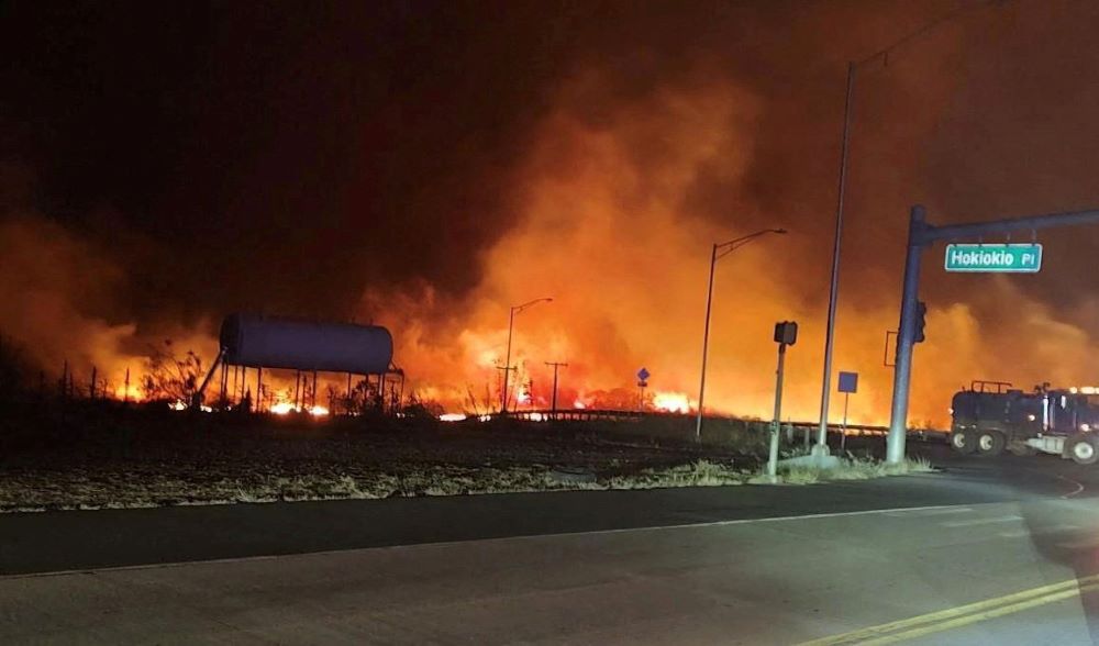 A wildfire burns on the island of Maui near an intersection in Lahaina, Hawaii, Aug. 9.