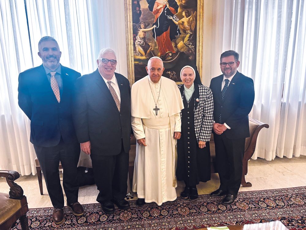 Pope Francis poses for a photo with Loretto Sister Jeannine Gramick, co-founder of New Ways Ministry, and three members of the staff of the ministry to and with LGBTQ+ Catholics Oct. 17 in the Domus Sanctae Marthae, the pope's Vatican residence.