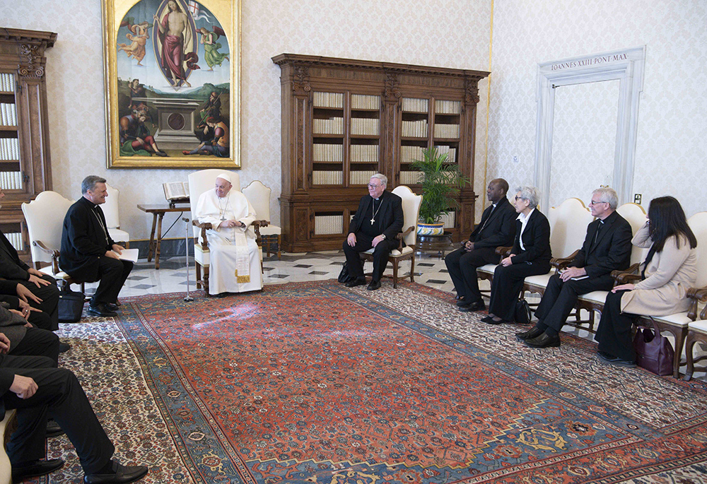 Pope Francis meets with members of the preparatory commission for the general assembly of the Synod of Bishops, March 16 at the Vatican. Pictured third from the right of Pope Francis is Mercedarian Sr. Shizue "Filo" Hirota from Tokyo. Sr. Filo Hirota speaks to NCR in Episode 2 of "The Vatican Briefing" podcast. (CNS/Vatican Media)