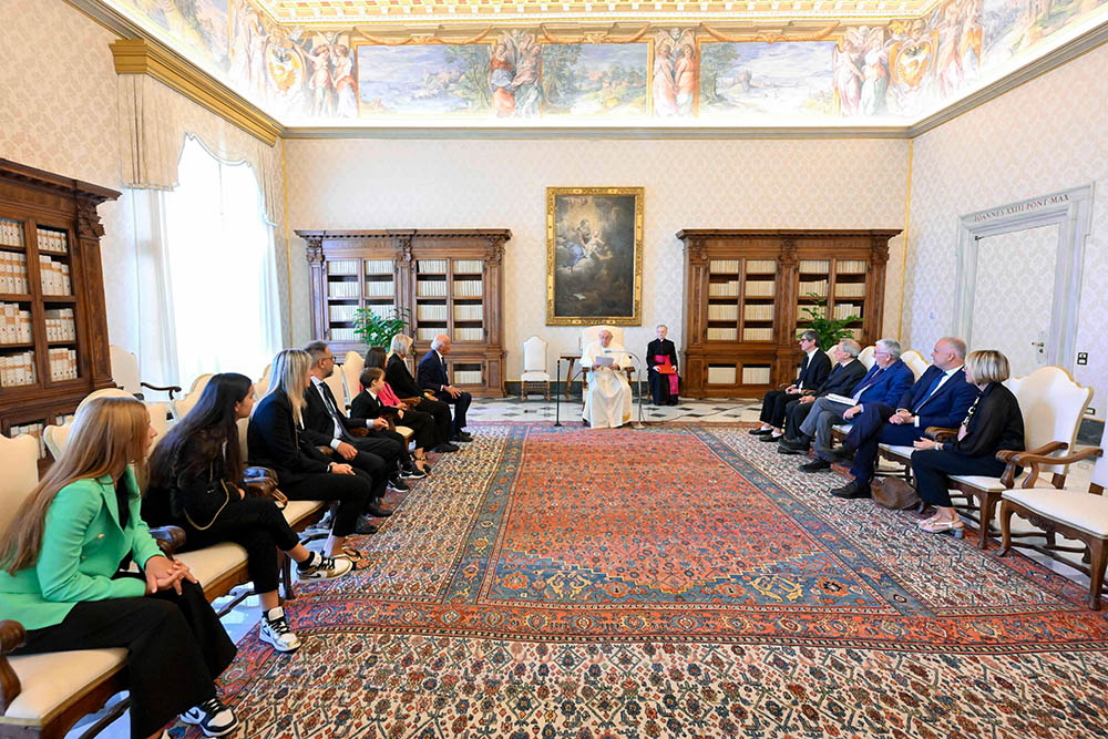 Pope Francis meets a delegation from the Italian "E' Giornalismo" prize during an audience in the library of the Apostolic Palace at the Vatican Aug. 26. The pope asked Italian journalists to help him communicate effectively about the upcoming Synod of Bishops. (CNS/Vatican Media)