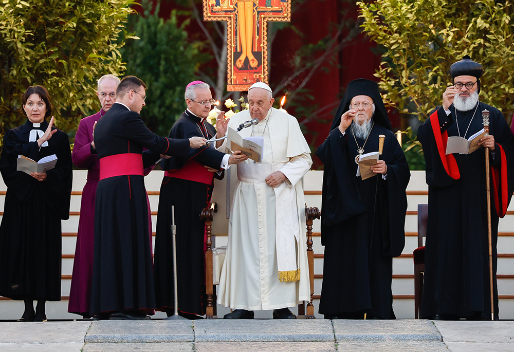 Pope Francis and other Christian leaders give their blessing at the end of an ecumenical prayer vigil in St. Peter's Square Sept. 30, ahead of the Synod of Bishops assembly: from left, are the Rev. Ann Burghardt, general secretary of the Lutheran World Federation; Anglican Archbishop Justin Welby of Canterbury; Francis; Orthodox Ecumenical Patriarch Bartholomew of Constantinople and Syriac Orthodox Patriarch Ignatius Aphrem II. (CNS/Lola Gomez)