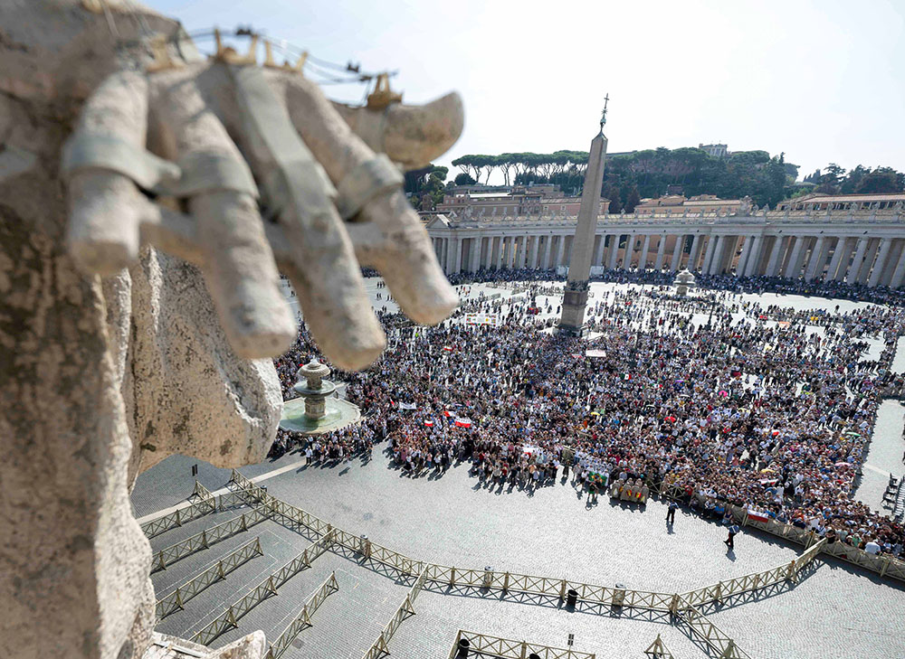 People gather to pray the Angelus with Pope Francis in St. Peter's Square at the Vatican Oct. 1. (CNS/Vatican Media)