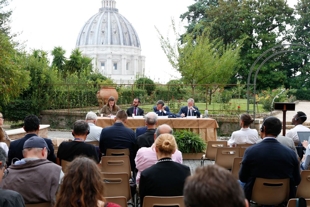 From left, Luisa-Marie Neubauer, a German climate activist; Jonathan Safran Foer, writer; Giorgio Parisi, winner of the 2021 Nobel Prize in Physics; and Matteo Bruni, director of the Vatican press office, speak at a conference about Pope Francis' document on the climate crisis "Laudate Deum" ("Praise God") in the Vatican Gardens Oct. 5, 2023. (CNS/Lola Gomez)