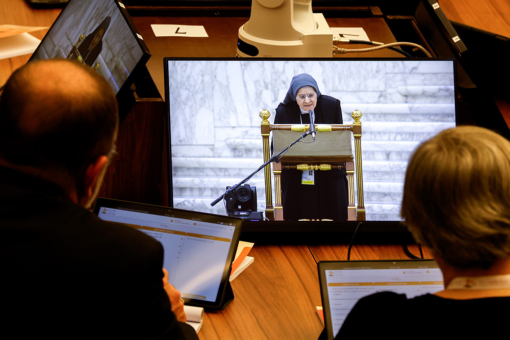 Benedictine Mother Maria Ignazia Angelini, a theologian, is seen on a video screen as she offers a biblical reflection at a working session of the assembly of the Synod of Bishops in the Vatican's Paul VI Audience Hall Oct. 13. (CNS/Lola Gomez)