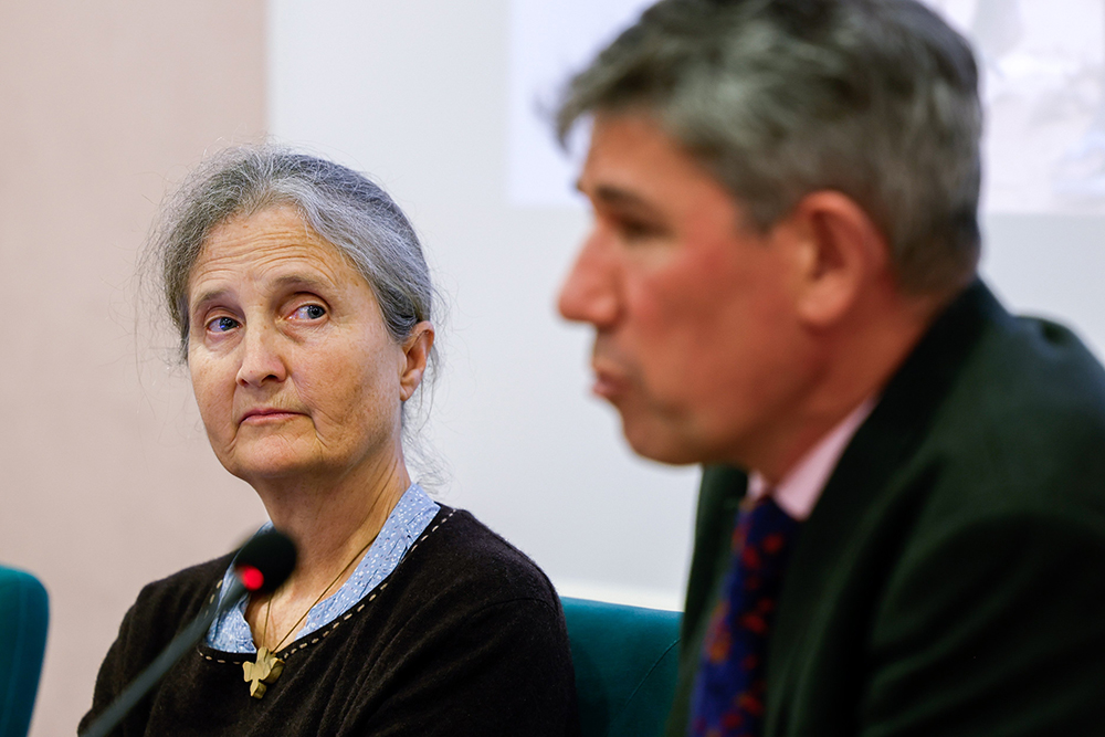Cécile Stone, lead author of the report "Displaced by a Changing Climate: Caritas Voices on Protecting and Supporting People on the Move," listens to Alistar Dutton, Caritas Internationalis secretary general, as he speaks during a press conference launching the report in Rome Oct. 26. (CNS/Lola Gomez)